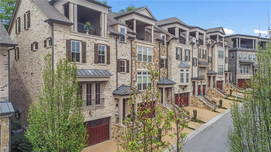 3440 Commander Cove Suwanee, GA 30024 - Photo 2 of 49 a large building with a lot of windows