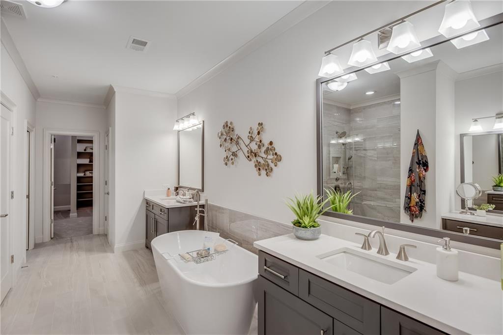 3440 Commander Cove Suwanee, GA 30024 - Photo 36 of 49 a bathroom with a sink double vanity and a mirror