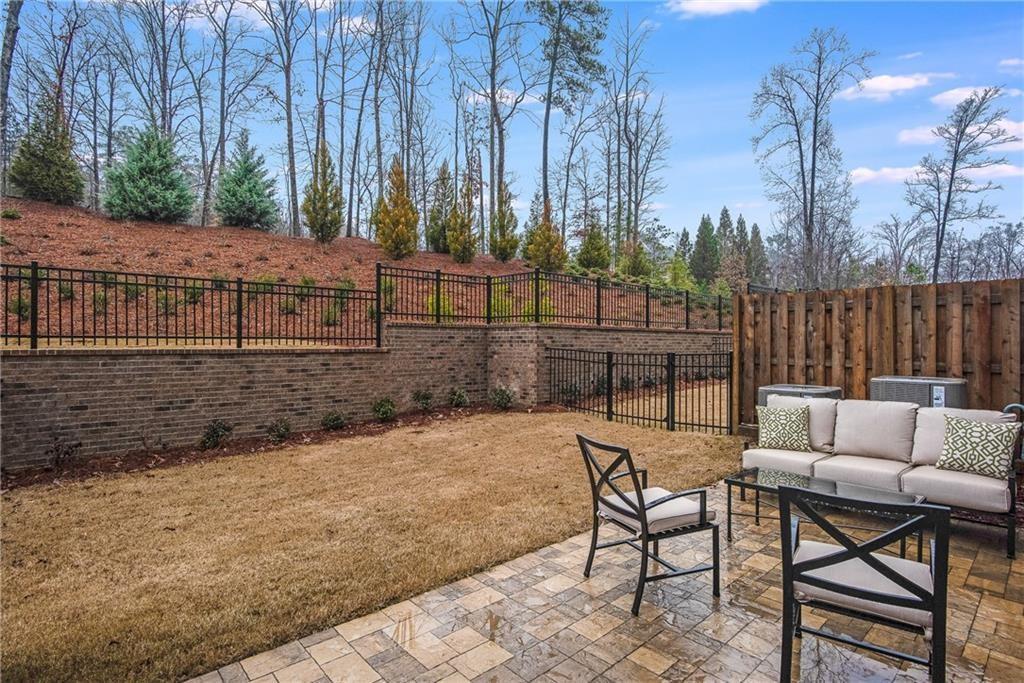 3440 Commander Cove Suwanee, GA 30024 - Photo 41 of 49 a view of a chairs and tables in the patio