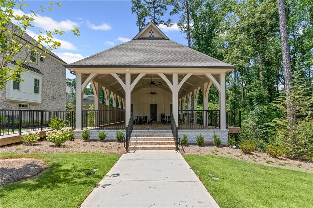 3440 Commander Cove Suwanee, GA 30024 - Photo 47 of 49 a front view of a house with a garden