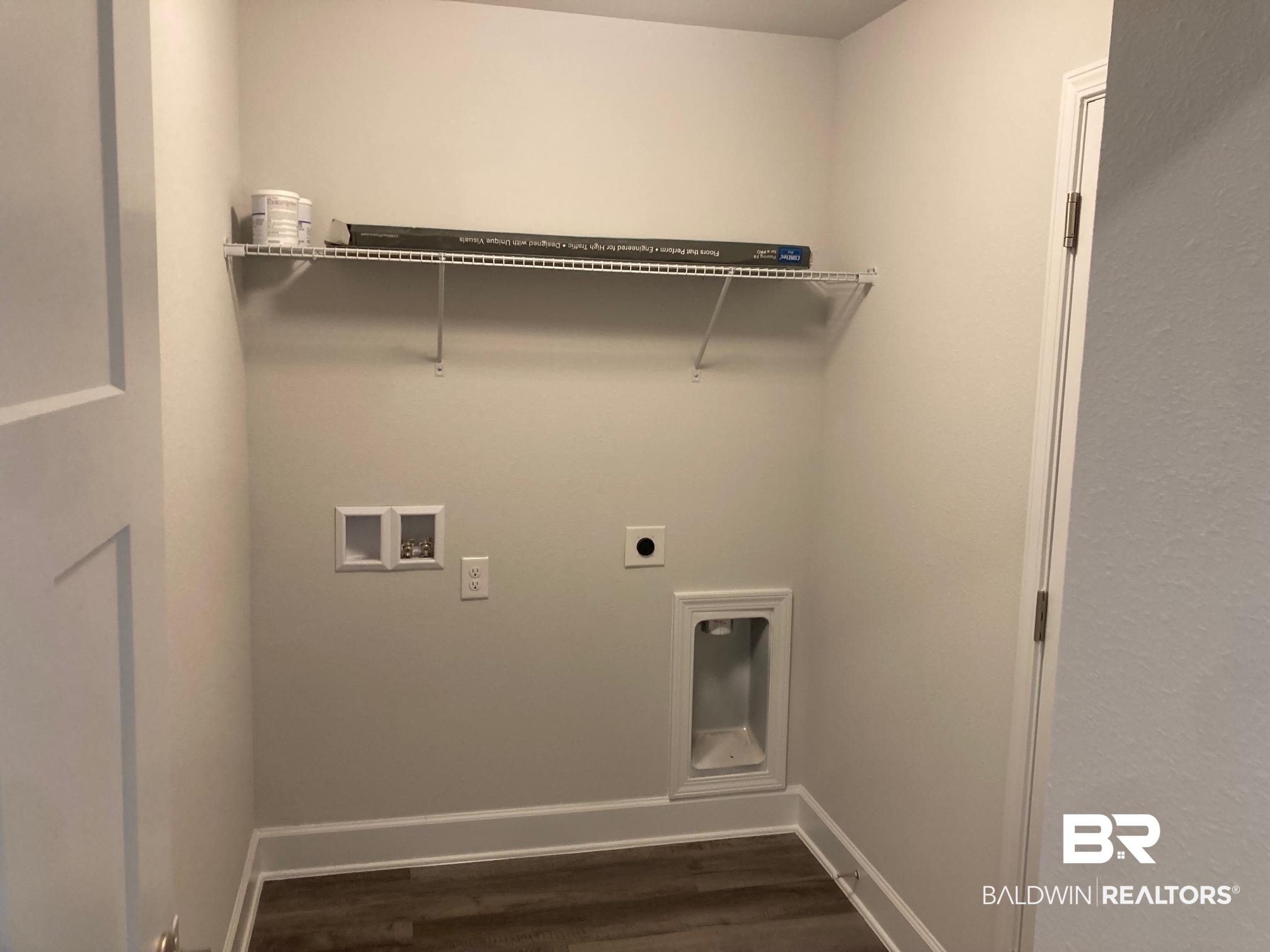 696 Mayflower Drive Foley, AL 36535 - Photo 21 of 25 Washroom with hookup for a washing machine, hookup for an electric dryer, and dark wood-style floors