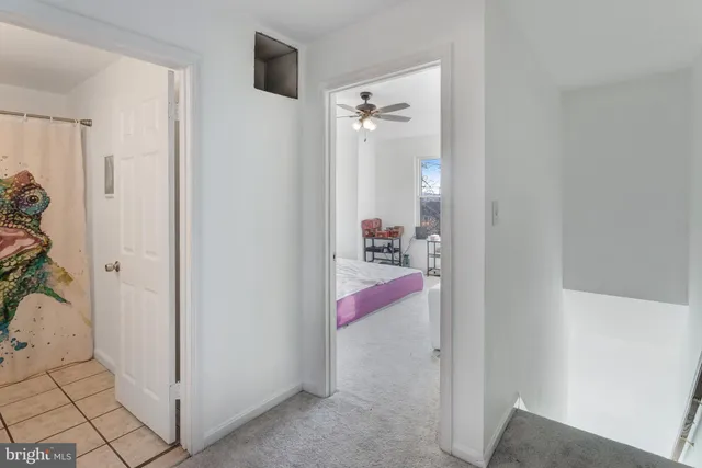 a bed room with a bed and a chair