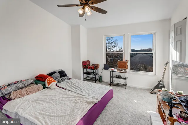 a bed room with a bed and a chandelier