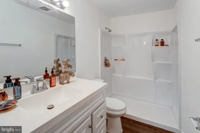 a view of balcony with wooden floor and fence