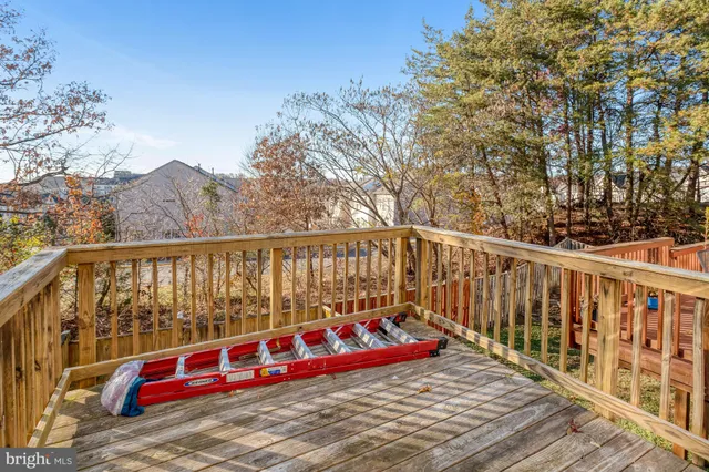 a view of a balcony with chair and the tables