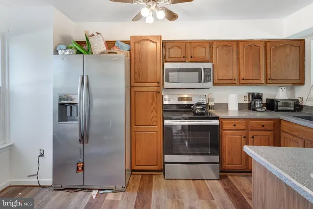 a kitchen with a refrigerator and a sink