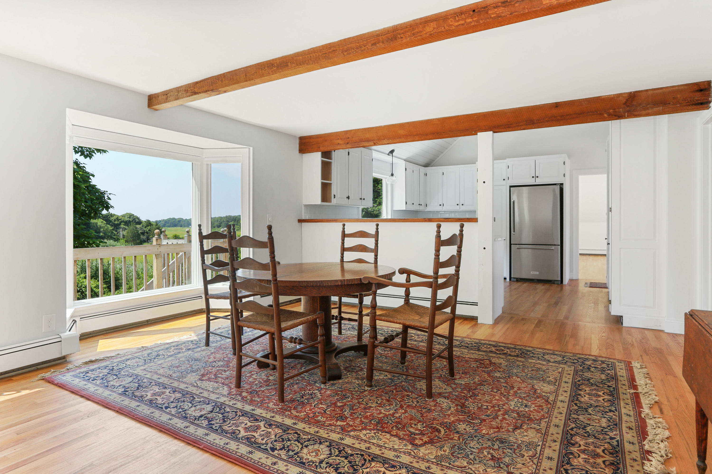 225 Goody Hallet Drive Eastham, MA 02642 - Photo 10 of 45 a dining room with furniture and wooden floor