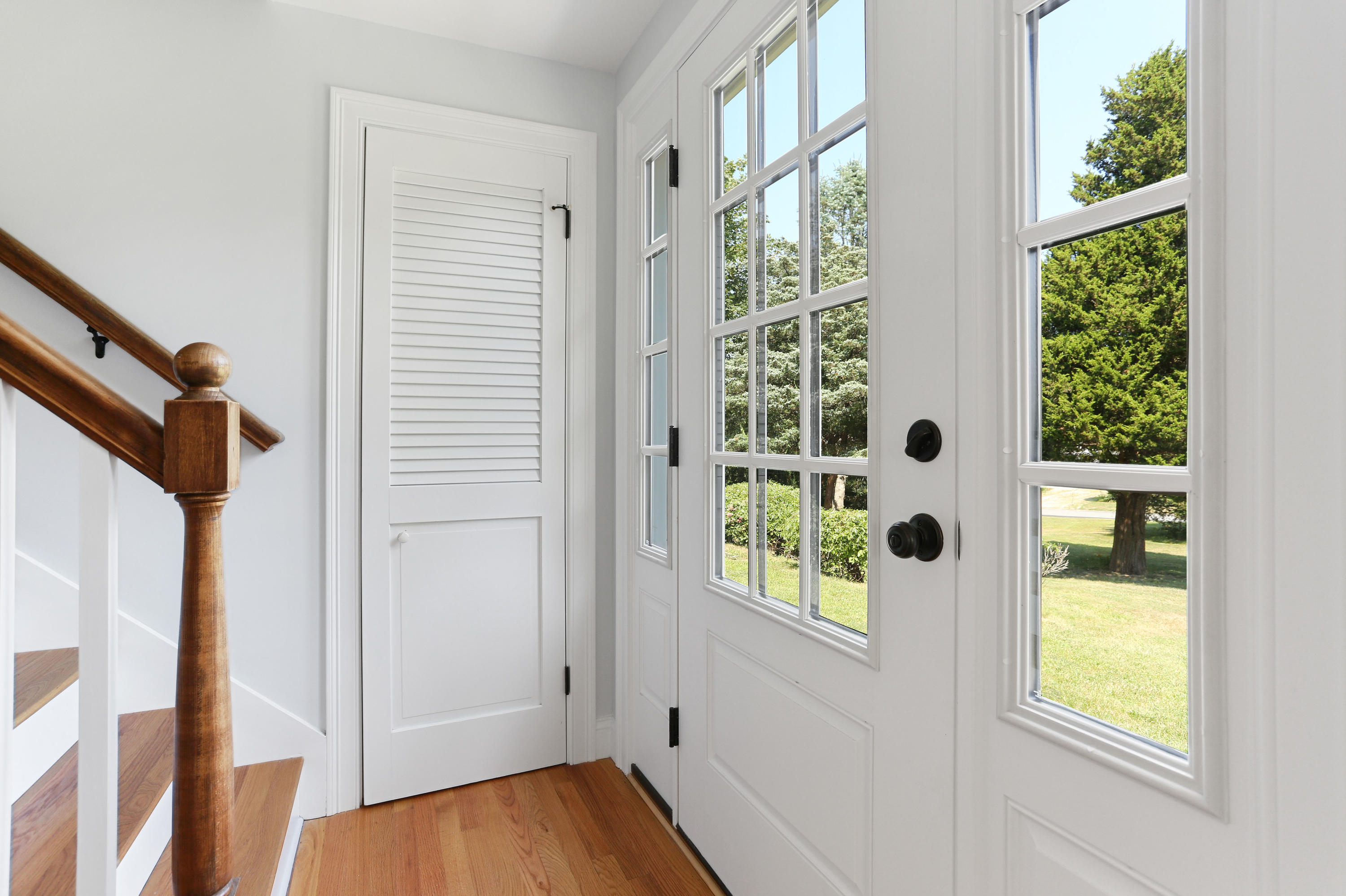 225 Goody Hallet Drive Eastham, MA 02642 - Photo 14 of 45 an entryway with wooden floor and windows