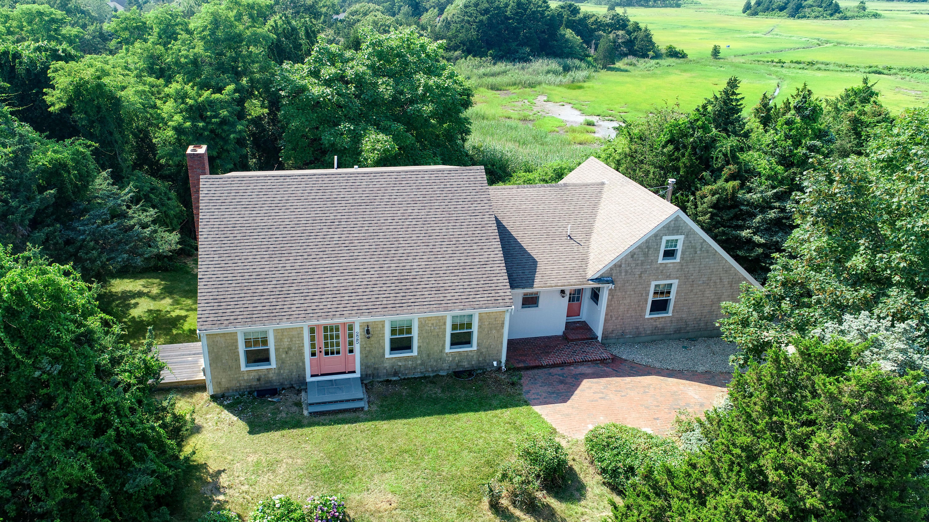 225 Goody Hallet Drive Eastham, MA 02642 - Photo 2 of 45 front view of a house with a yard
