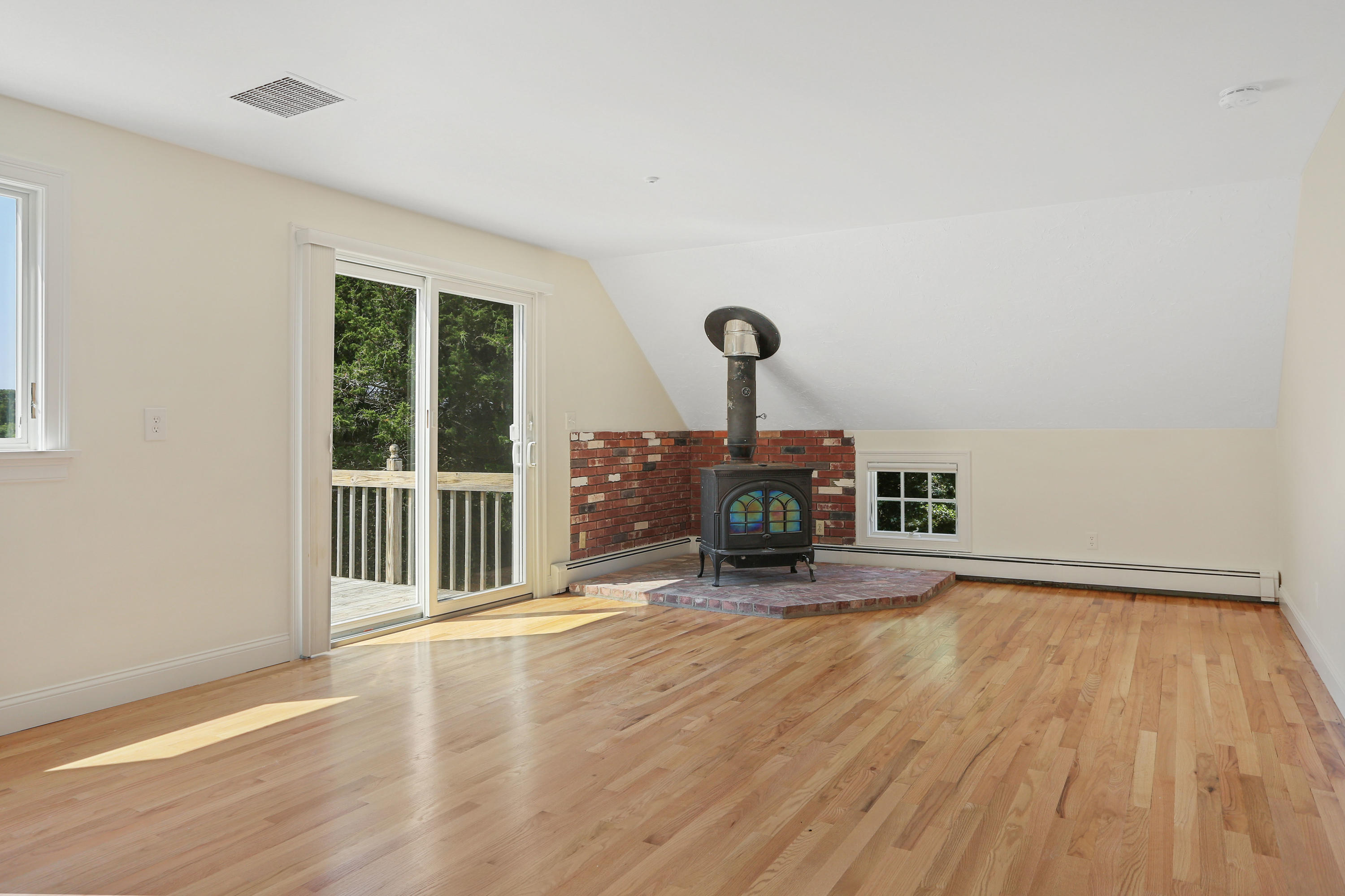 225 Goody Hallet Drive Eastham, MA 02642 - Photo 20 of 45 a view of empty room with furniture and wooden floor