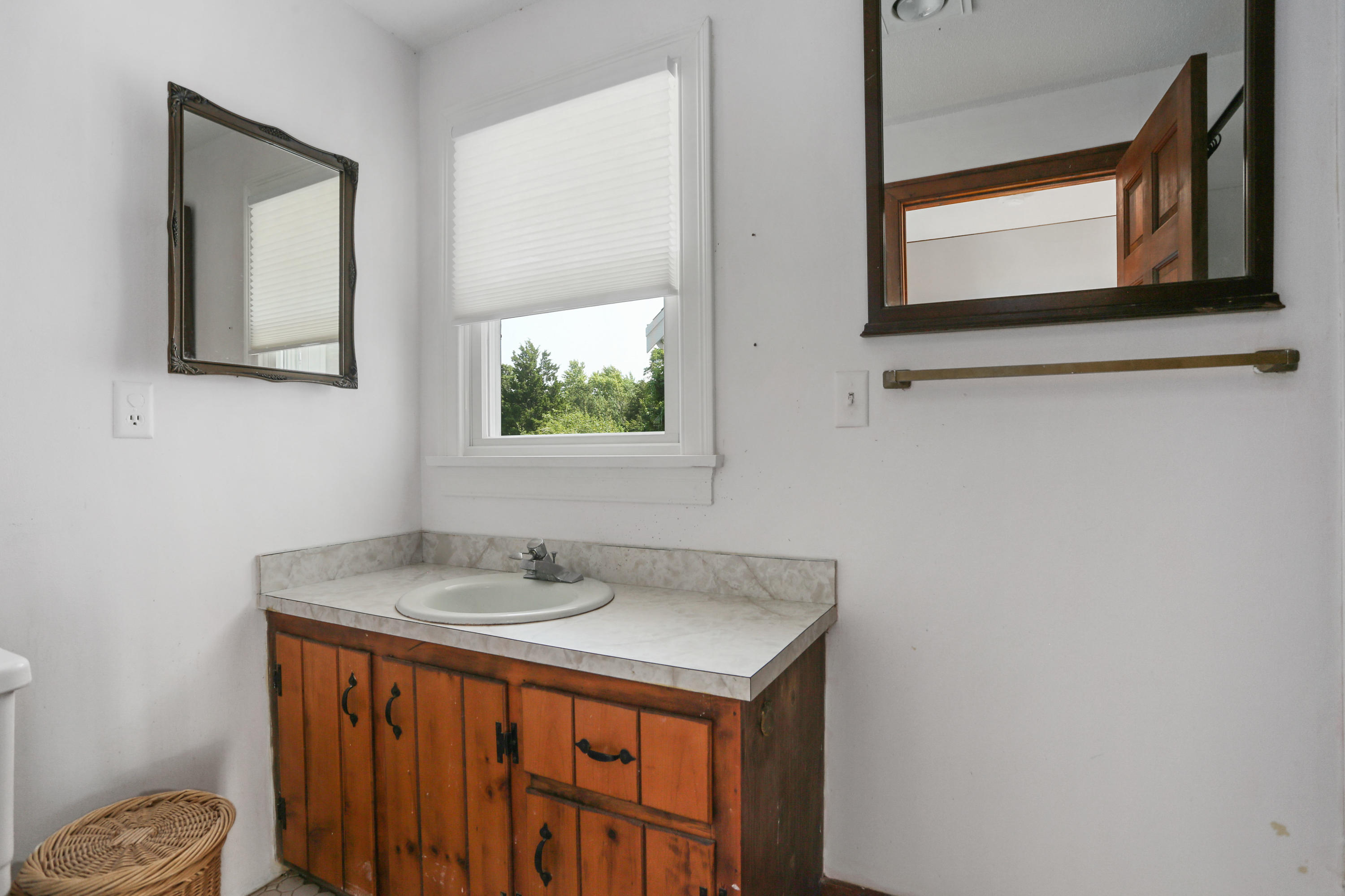 225 Goody Hallet Drive Eastham, MA 02642 - Photo 28 of 45 a bathroom with a sink and a mirror