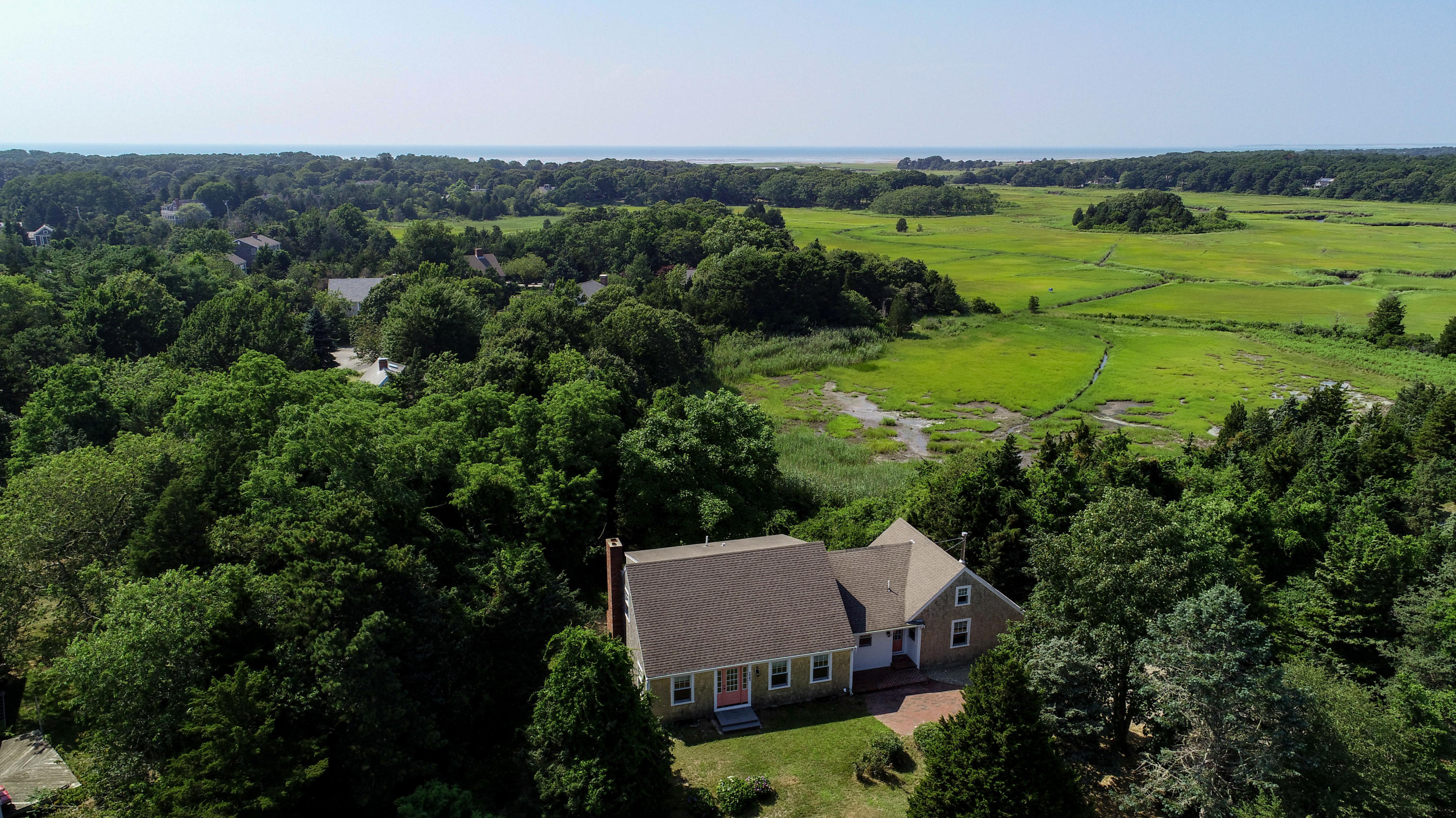 225 Goody Hallet Drive Eastham, MA 02642 - Photo 37 of 45 an aerial view of a house with yard and outdoor seating