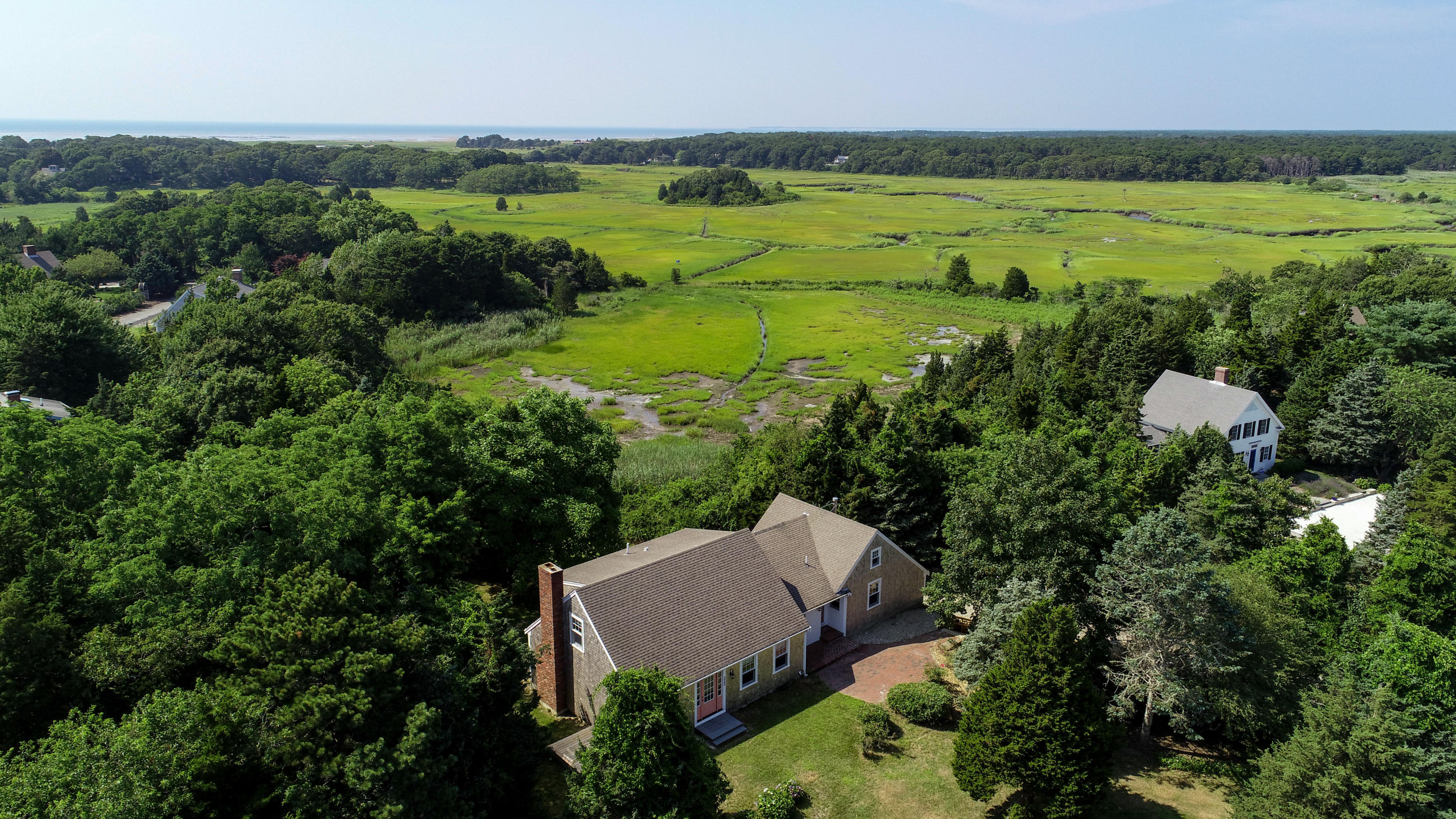 225 Goody Hallet Drive Eastham, MA 02642 - Photo 38 of 45 an aerial view of a houses with outdoor space and trees all around