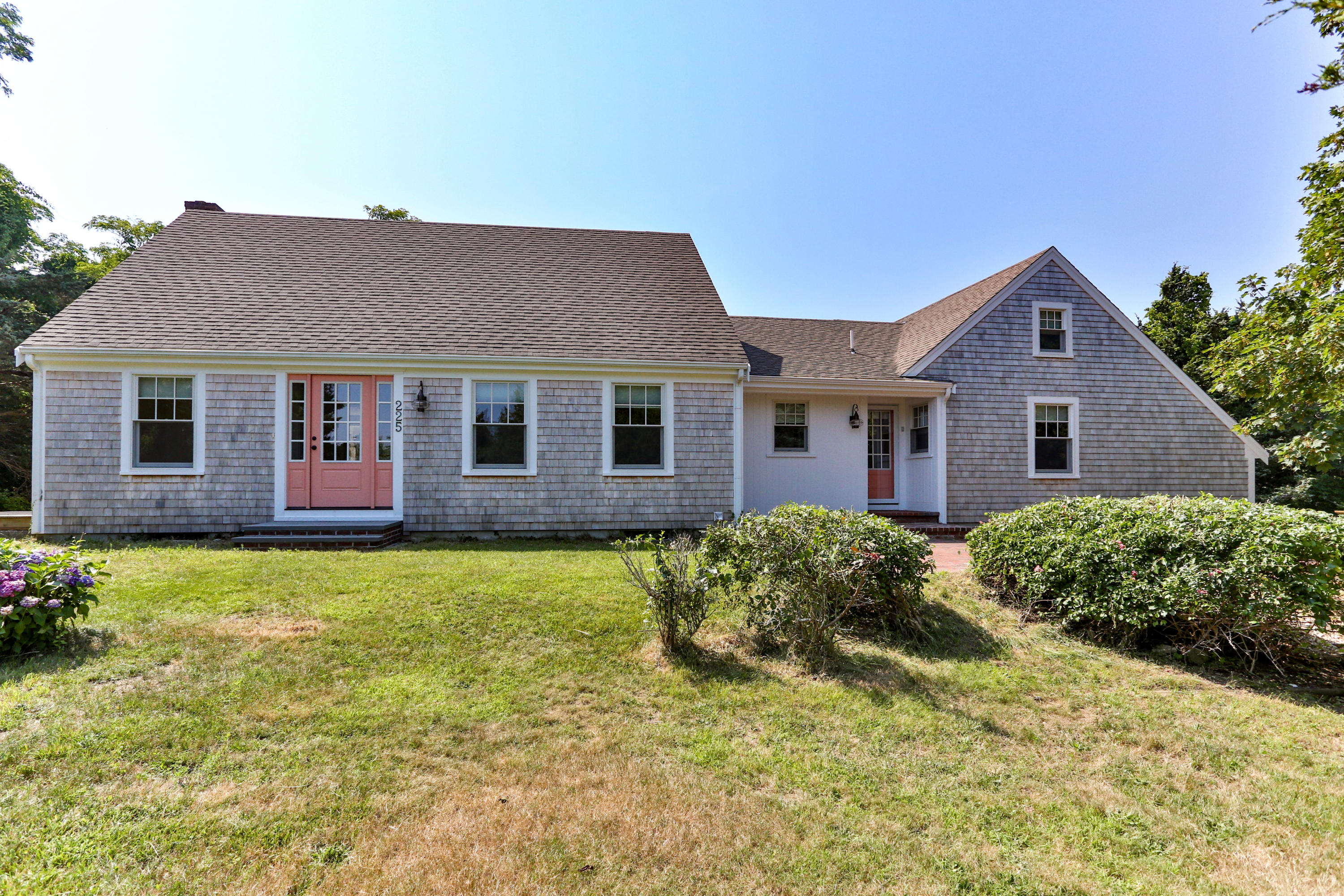 225 Goody Hallet Drive Eastham, MA 02642 - Photo 5 of 45 a brick house with a large windows
