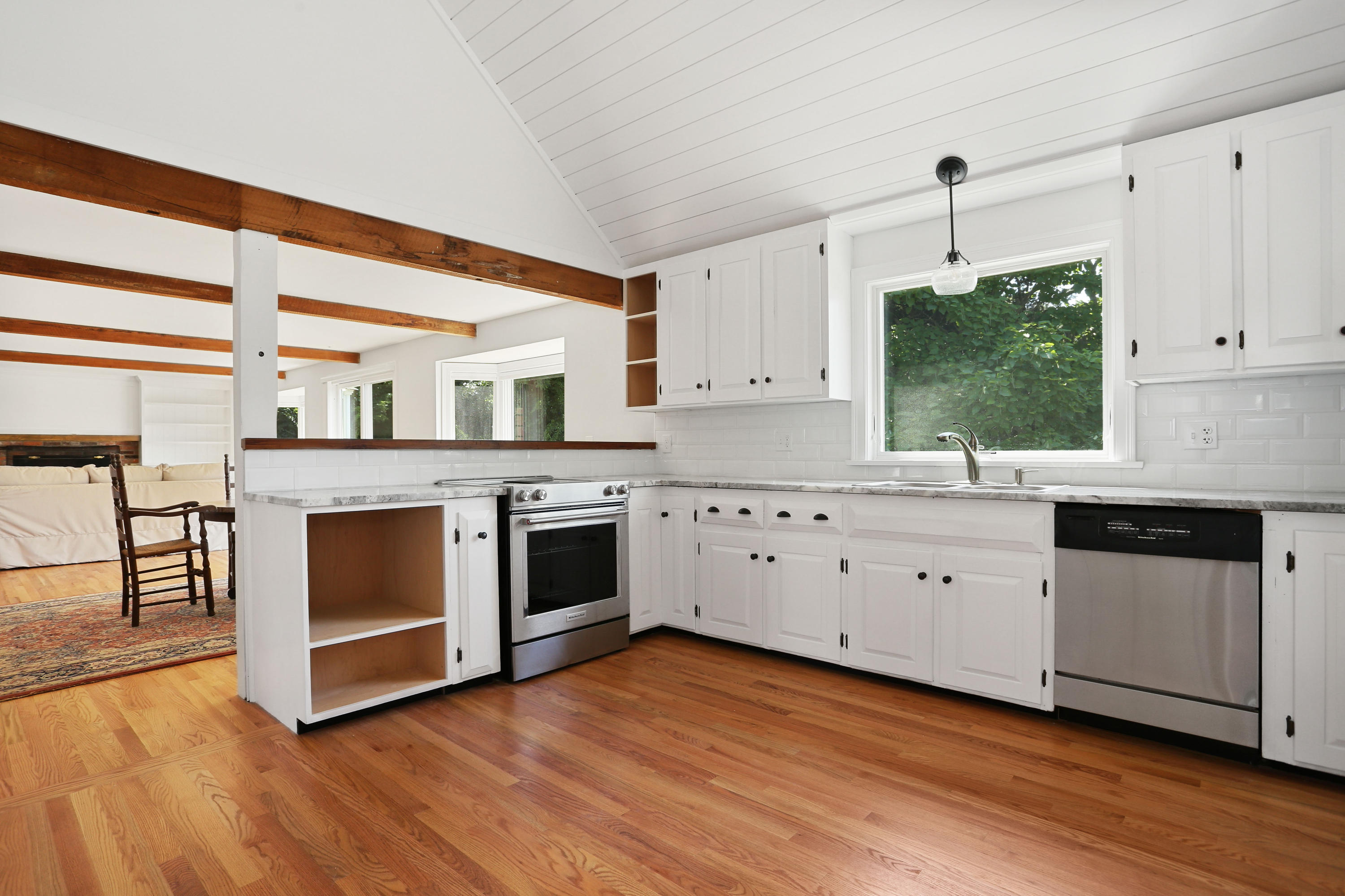 225 Goody Hallet Drive Eastham, MA 02642 - Photo 45 of 45 a kitchen with stainless steel appliances a stove top oven and a wooden floors