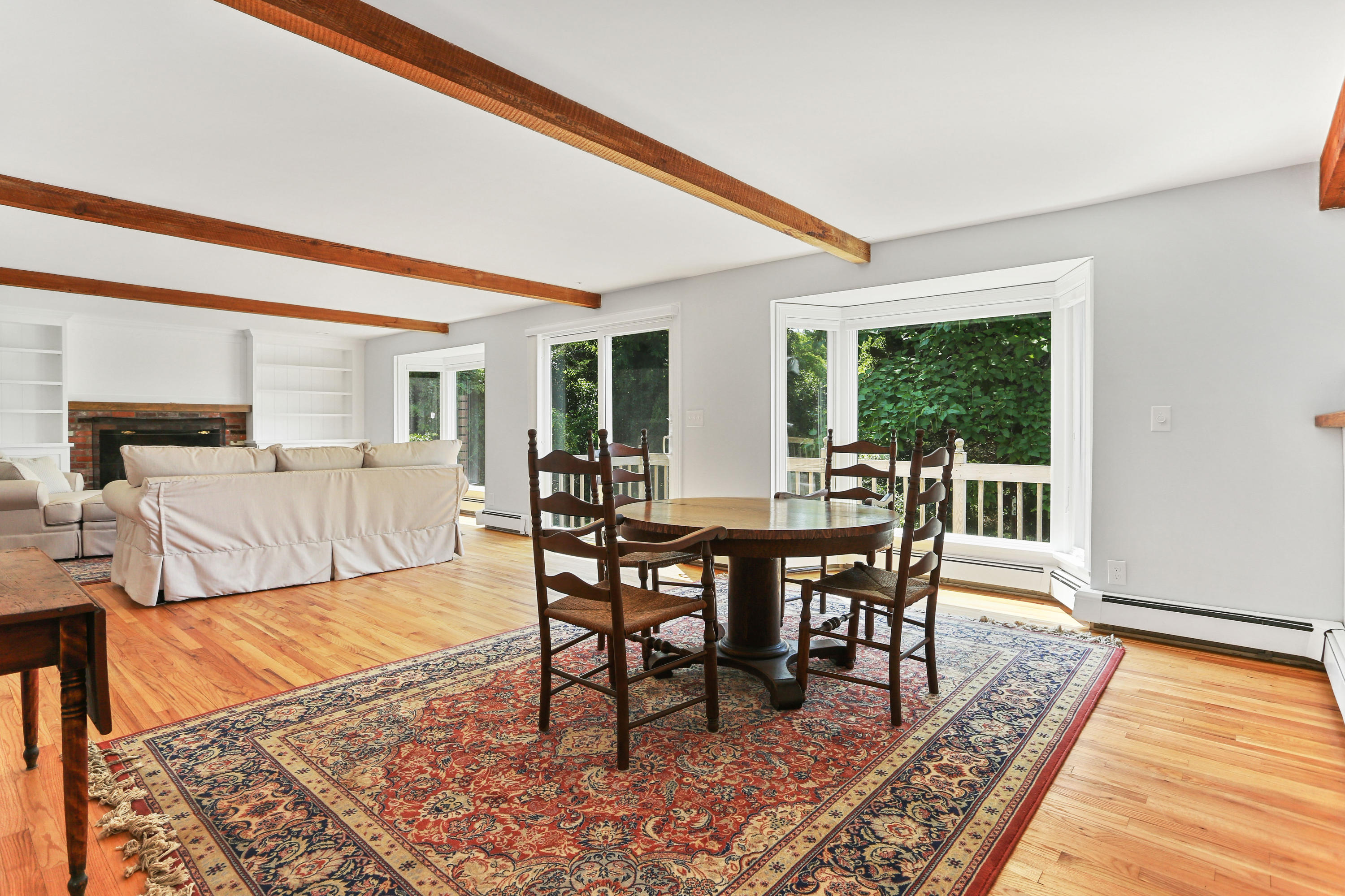 225 Goody Hallet Drive Eastham, MA 02642 - Photo 9 of 45 a view of a dining room with furniture