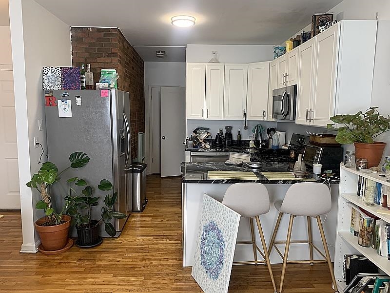 a kitchen with a table and chairs in it