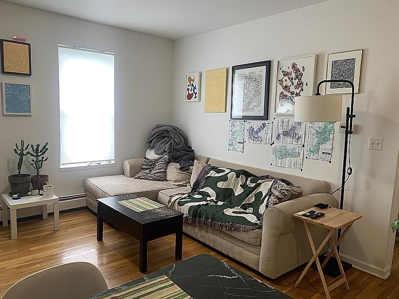 233 Griffith Street, Unit 2E Jersey City, NJ 07307 - Photo 4 of 12 a living room with furniture