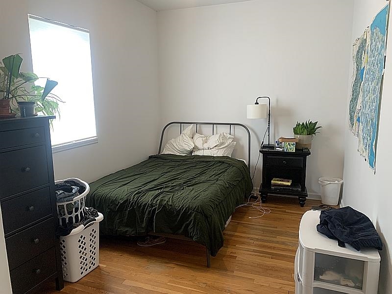 233 Griffith Street, Unit 2E Jersey City, NJ 07307 - Photo 8 of 12 a bedroom with a bed and a window
