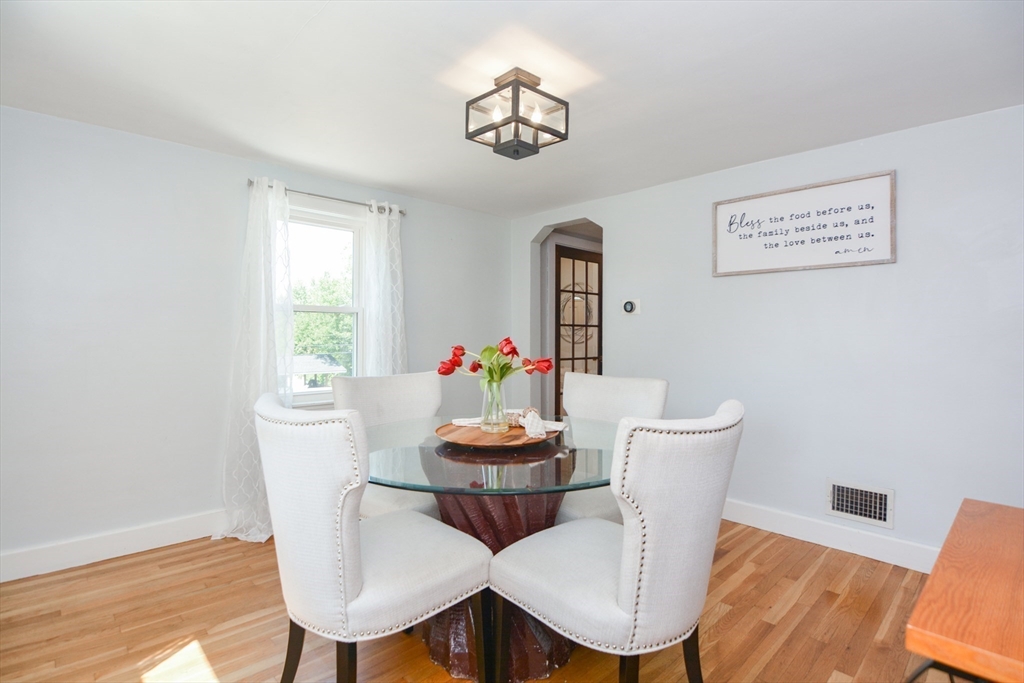 16 Lohnes Road Framingham, MA 01701 - Photo 8 of 41 a view of a dining room with furniture window and wooden floor
