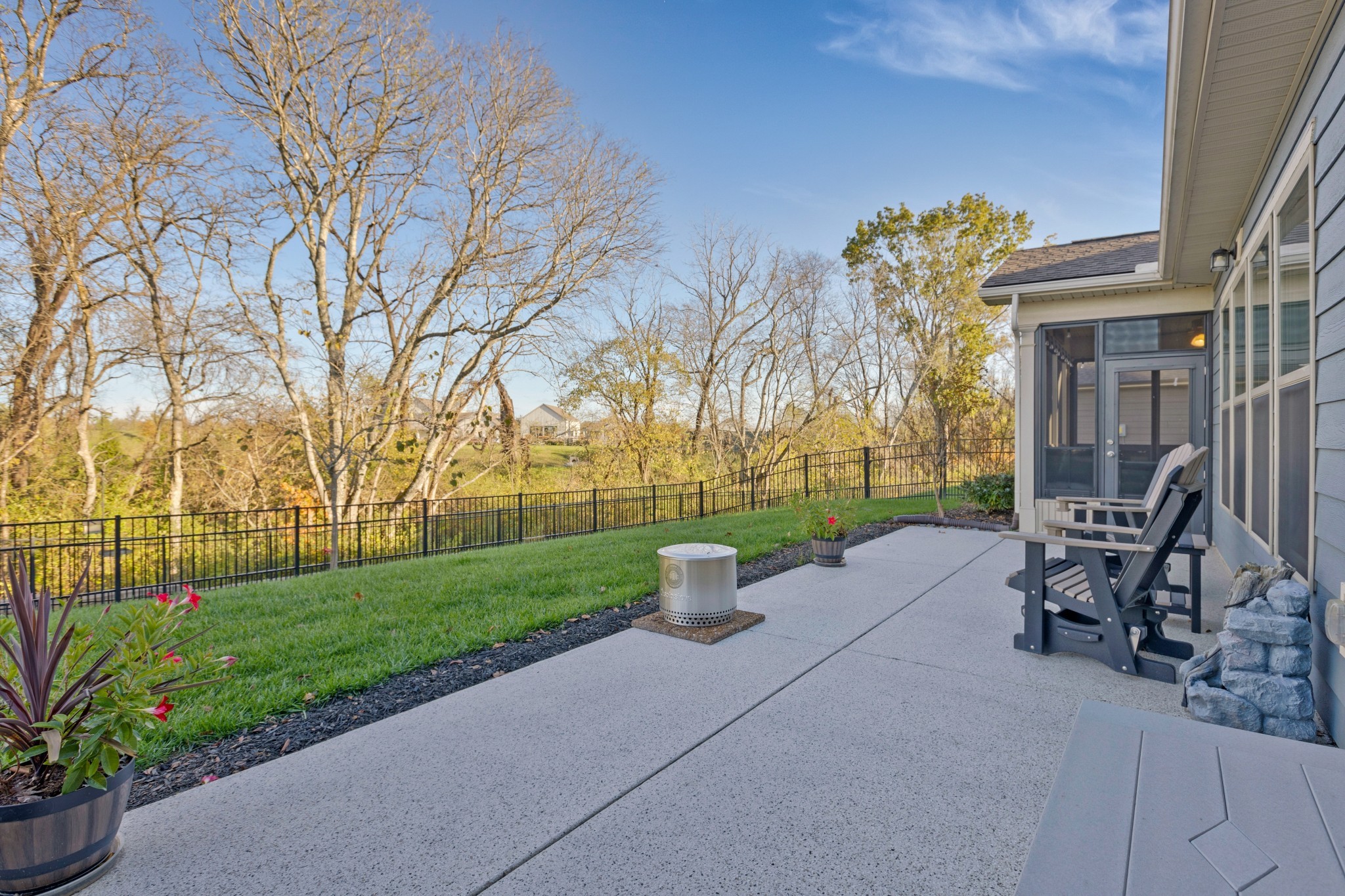 2132 Loudon Hill Spring Hill, TN 37174 - Photo 35 of 54 a view of a patio with a table and chairs next to a yard