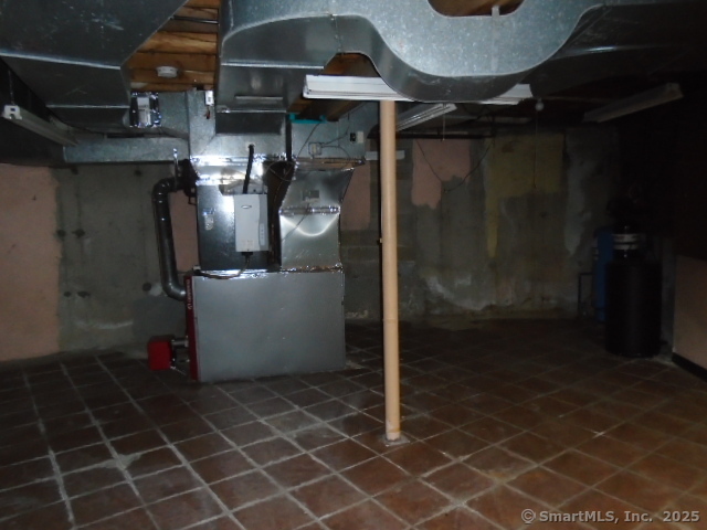 11 Timbercrest Drive Canton, CT 06019 - Photo 23 of 39 a room with water heater and wooden racks