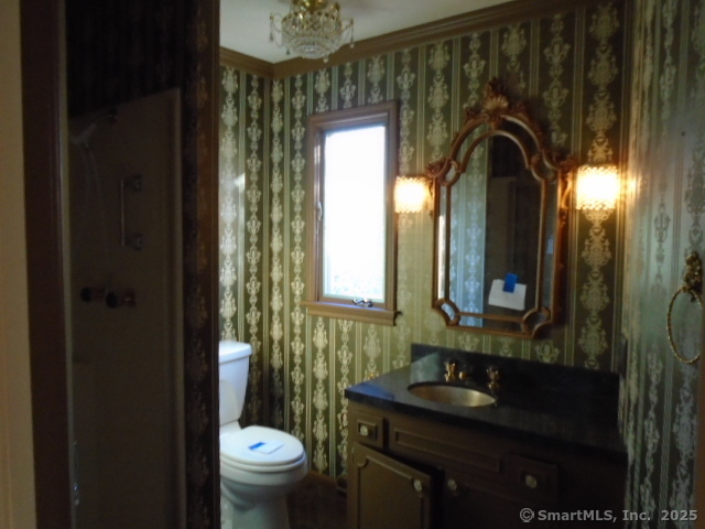 11 Timbercrest Drive Canton, CT 06019 - Photo 24 of 39 a bathroom with a toilet sink and mirror