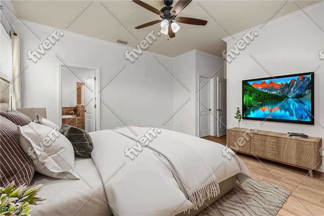 16471 Windsor Way Alva, FL 33920 - Photo 12 of 23 a bedroom with a bed and a flat screen tv