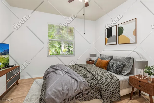 a bedroom with bed and wooden floor