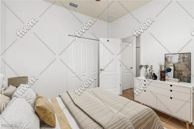 a bedroom with a bed and a large mirror on the dresser