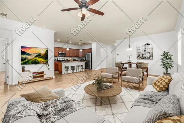 a living room with furniture kitchen view and a flat screen tv