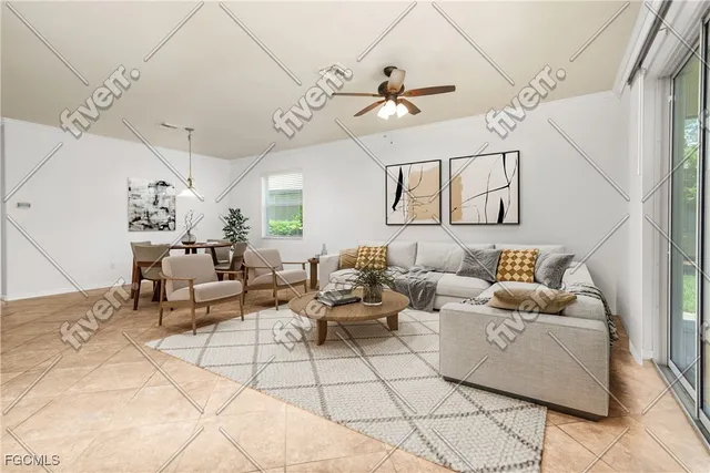 a living room with patio furniture and a chandelier