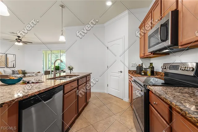 a kitchen with stainless steel appliances granite countertop a sink and cabinets