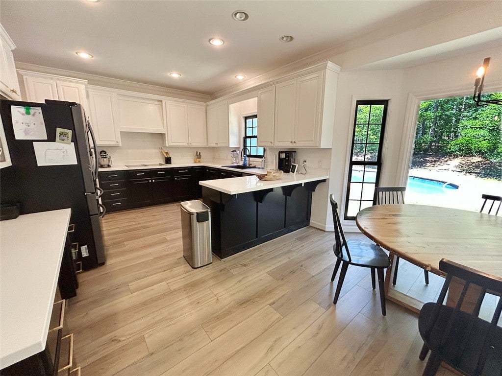 2004 Moores Mill Road Lanett, AL 36863 - Photo 21 of 50 This kitchen offers modern design with ample counter space and scenic views of the pool.