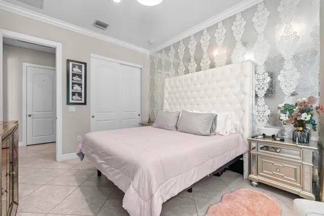 a bedroom with a bed and a cabinets