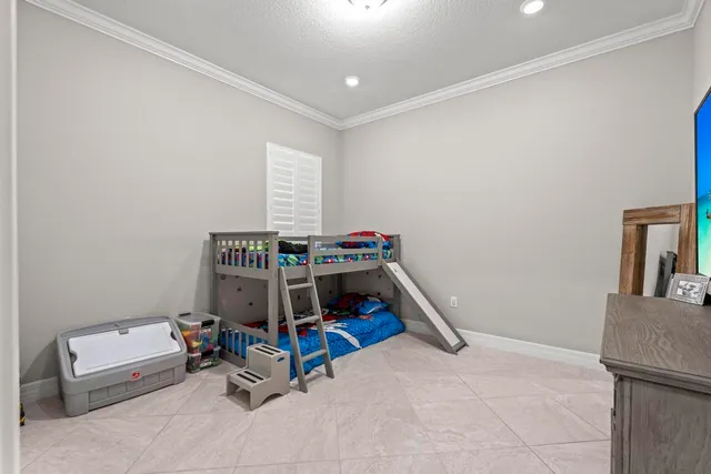 a room with furniture and air conditioner vent