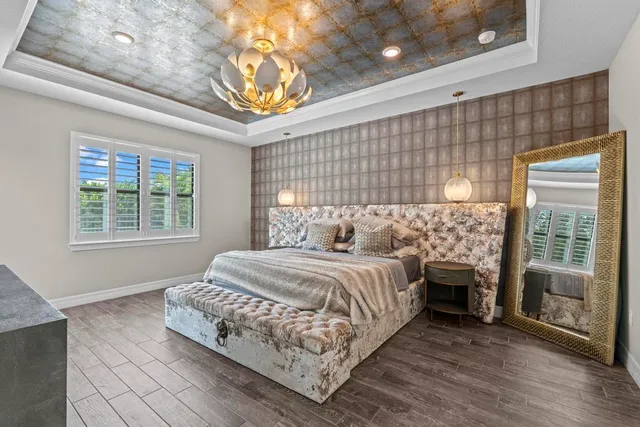 a spacious bedroom with a bed and a window