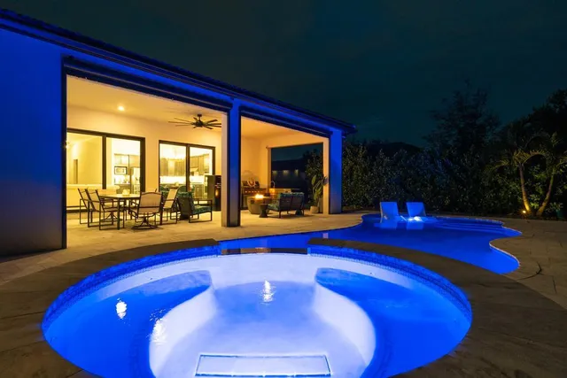 a view of swimming pool with outdoor seating