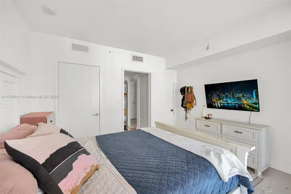 a bathroom with a granite countertop toilet a sink and a bathtub
