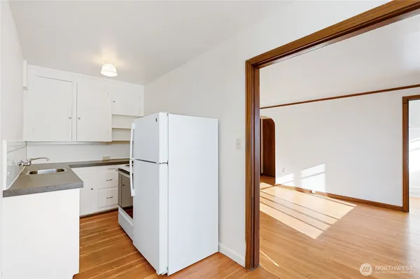 a kitchen with a refrigerator a sink and dishwasher