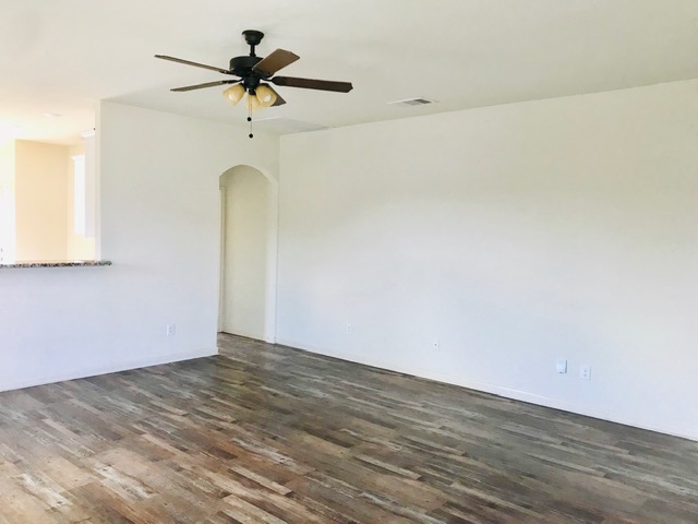 20105 Grover Cleveland Way Manor, TX 78653 - Photo 6 of 17 Wood flooring extends throughout this versatile, open-concept interior space.