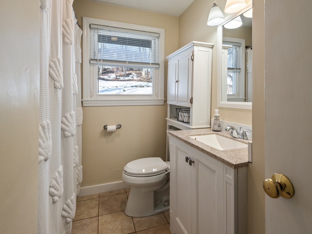248 St Nicholas Avenue Worcester, MA 01606 - Photo 16 of 30 a bathroom with a sink toilet and shower