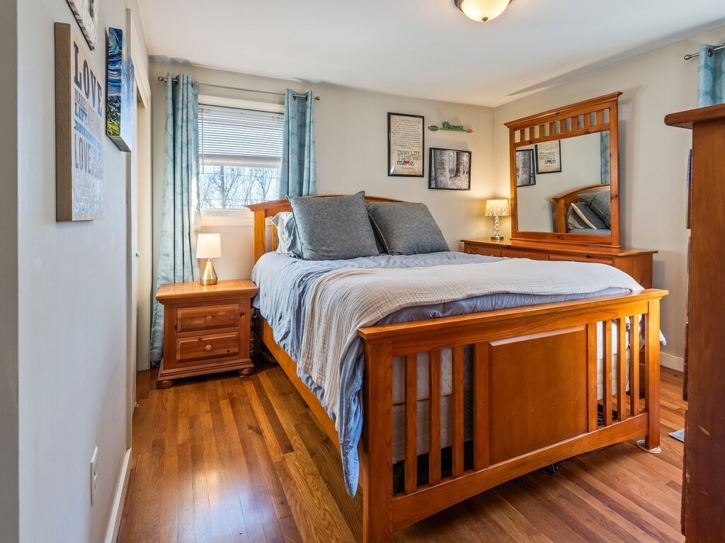 248 St Nicholas Avenue Worcester, MA 01606 - Photo 17 of 30 a bed sitting in a bedroom next to a window