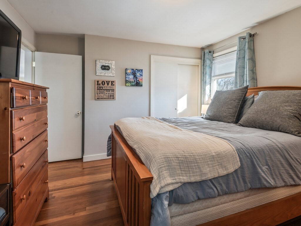 248 St Nicholas Avenue Worcester, MA 01606 - Photo 18 of 30 a bedroom with a bed and a dresser