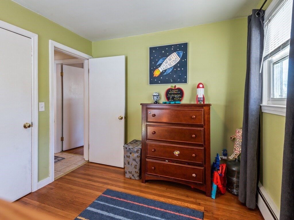 248 St Nicholas Avenue Worcester, MA 01606 - Photo 21 of 30 a room with a bed and a dresser