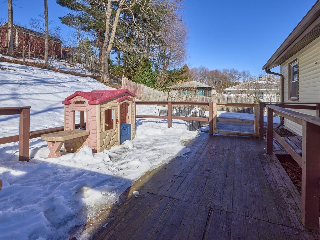 248 St Nicholas Avenue Worcester, MA 01606 - Photo 26 of 30 a view of a rooftop deck with couch and wooden floor