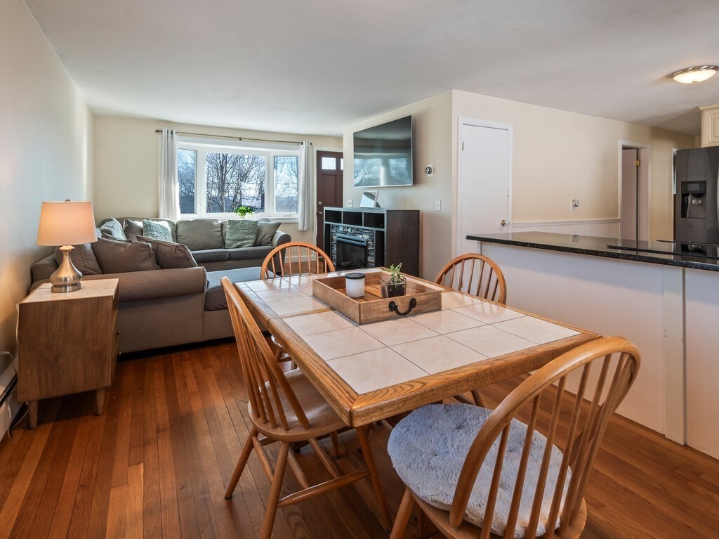 248 St Nicholas Avenue Worcester, MA 01606 - Photo 8 of 30 a view of a dining room with furniture window and wooden floor
