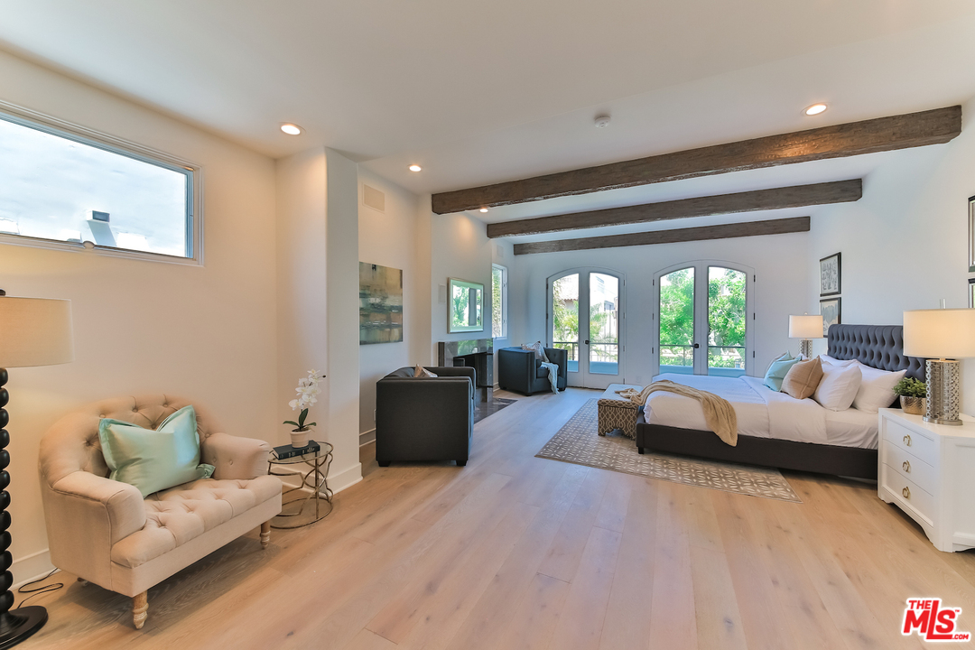 124 Reef Mall Marina del Rey, CA 90292 - Photo 21 of 44 a living room with furniture and a large window