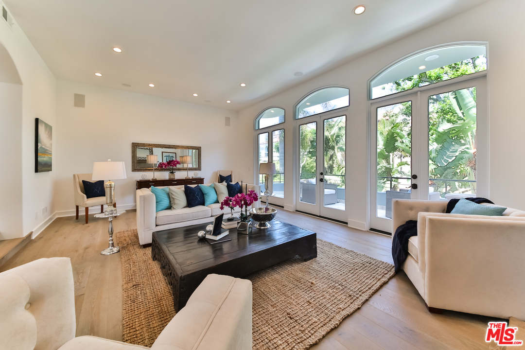 124 Reef Mall Marina del Rey, CA 90292 - Photo 4 of 44 a living room with furniture and a large window