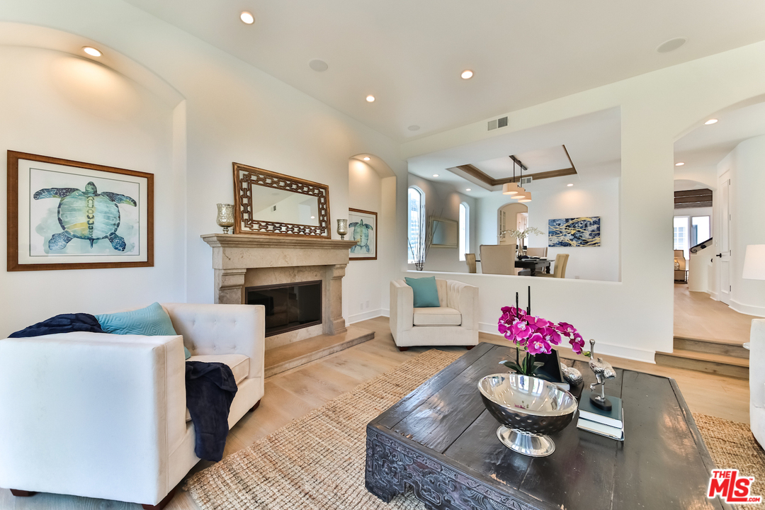 124 Reef Mall Marina del Rey, CA 90292 - Photo 6 of 44 a living room with furniture and a fireplace